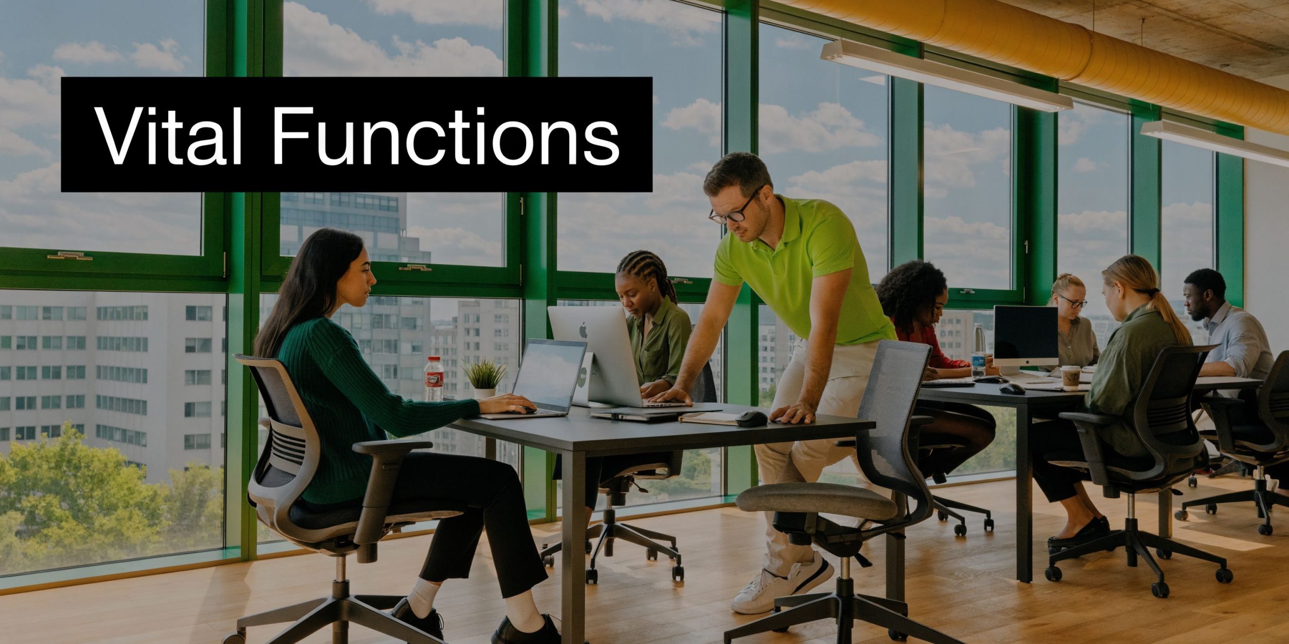 A diverse group of professionals collaborating in a modern office space with floor-to-ceiling windows.