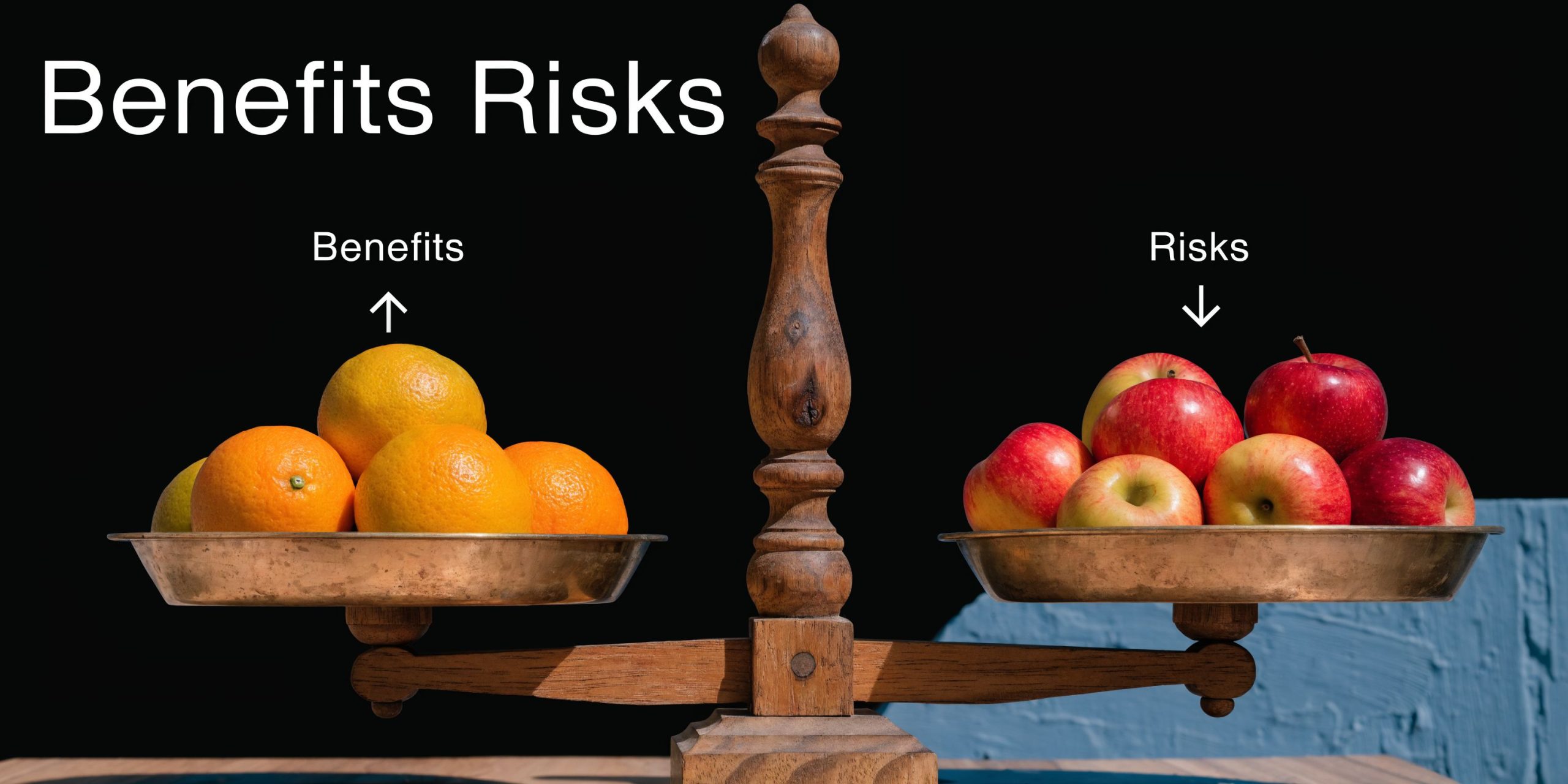 A wooden balance scale comparing benefits and risks represented by oranges on one side and apples on the other.